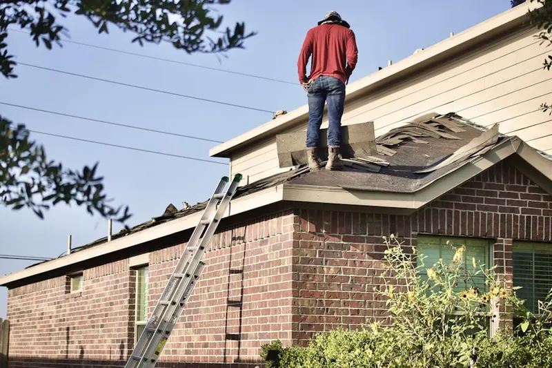 Professional roofer working on a residential roof in Deep Landing Estates